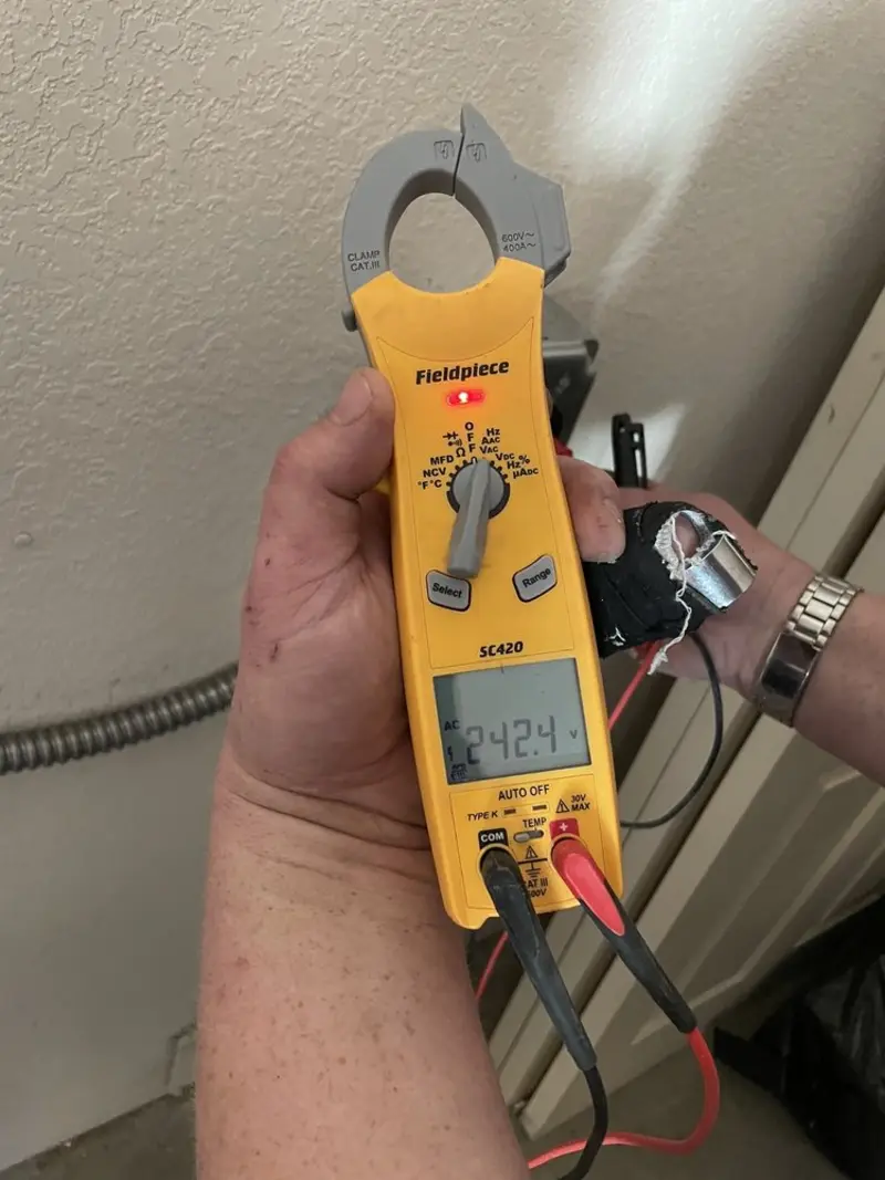 Voltage testing with clamp meter during Generator Installation in Alderwood Manor